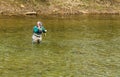 Fisherman Releasing a Trout Back into the Roanoke River, Virginia, USA